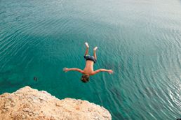 boy-jumping-into-lake