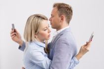 couple-looking-at-phones